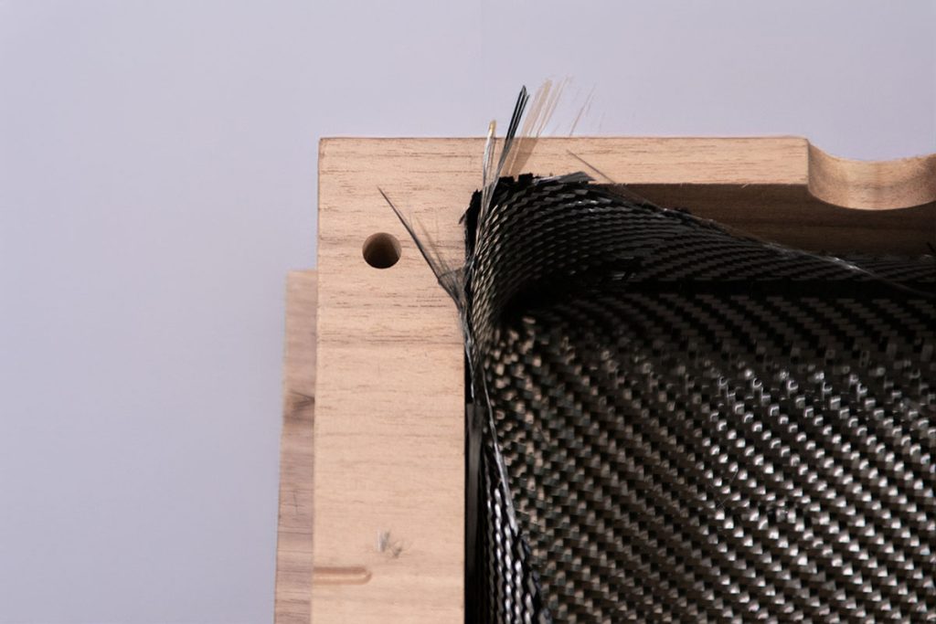 Armour component by Moitech combining carbon fiber and wood for custom nautical design - 2